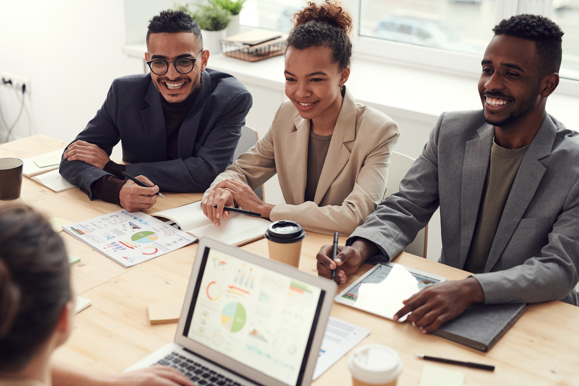 photo-of-three-people-smiling-while-having-a-meeting-3184338-big